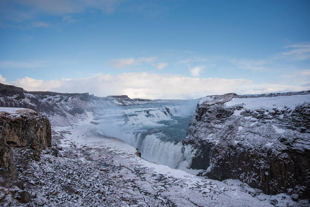 Aerial view of famous tourist attraction Gullfoss waterfall in the frozen landscape of Iceland in the winter - Zdjęcie, obraz