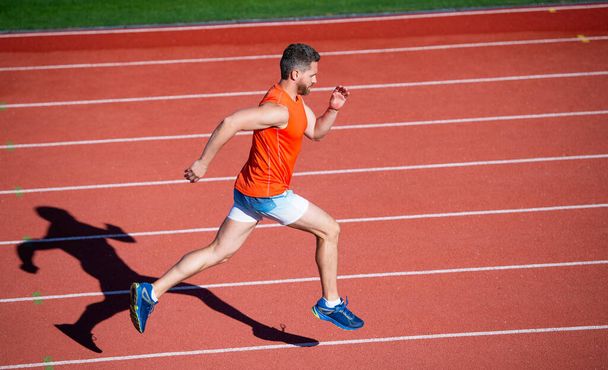 physical training. athletic guy run. challenge and competition. marathon speed. sprinter. - Valokuva, kuva