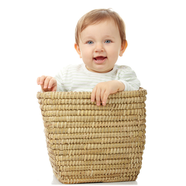 Young baby girl in basket - Foto, imagen