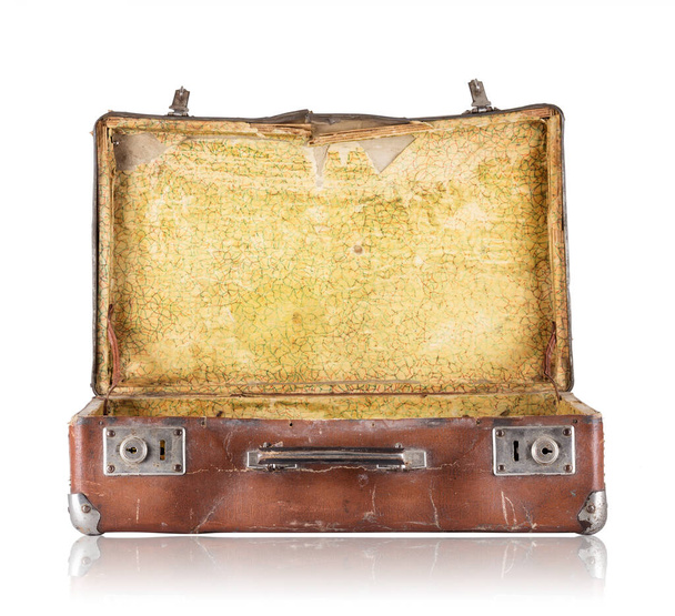 Open old suitcase with yellow upholstery inside isolated on white background - Foto, Imagem