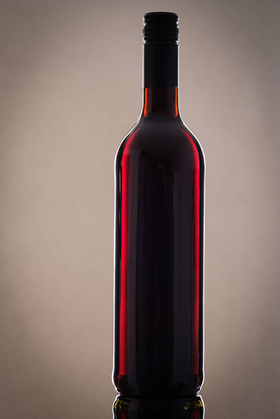red wine bottle with a glass of white and black background - Fotografie, Obrázek
