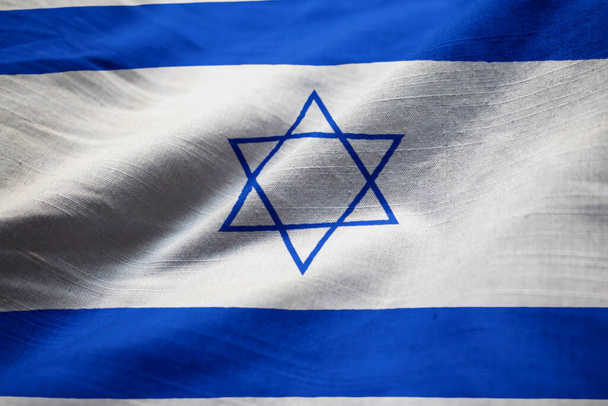 Closeup of Ruffled Israel Flag, Israel Flag Blowing in Wind - Foto, afbeelding