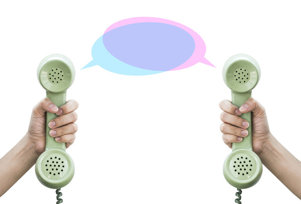 Comunicación. Sostenga el teléfono retro aislado en respaldo blanco
 - Foto, Imagen