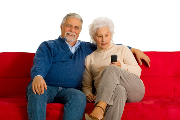 Elderly couple on the sofa - Фото, изображение