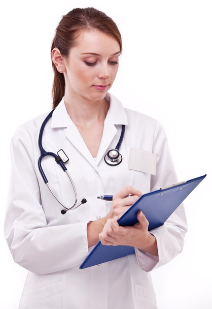 Doctor completing on medical card. Isolated on a white backgroun - Foto, Imagem