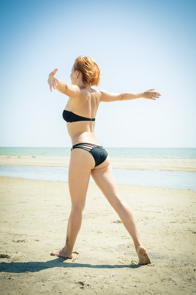 Beautiful woman on a beach - Фото, изображение