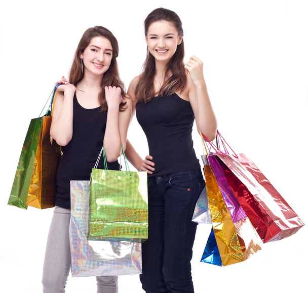 Girl with shopping bags on a white background. - Foto, Imagen