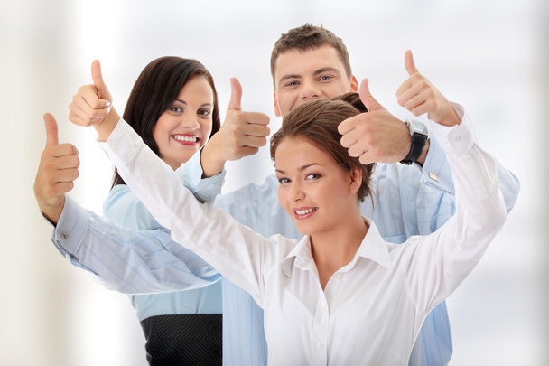 Business team with thumbs up - Foto, imagen