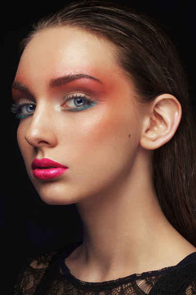 Portrait of beautiful young woman. Perfect makeup. Fashion photo - 写真・画像
