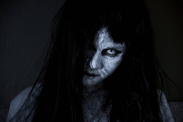Close up face of horror woman ghost cruel, halloween day concept - Fotó, kép