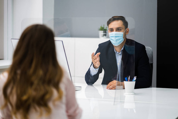 Young Woman Meeting Consultant Or Lawyer With Face Masks - Foto, afbeelding
