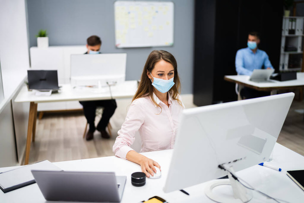Business Team Training. Working On Computer With Face Mask - Photo, image