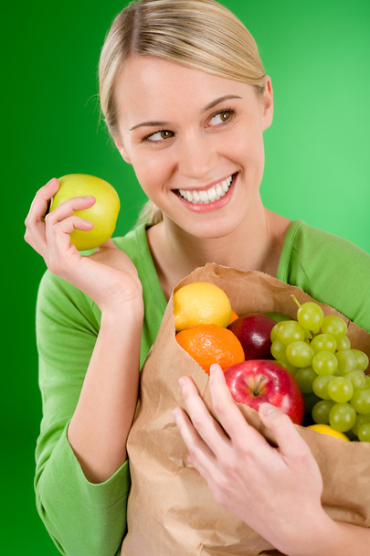 Healthy lifestyle - woman with fruit shopping paper bag - Foto, imagen