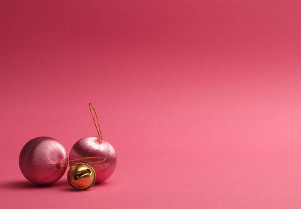 Pink vintage Christmas baubles on a pink background with space for your text or image, seasonal holiday concept - Fotó, kép