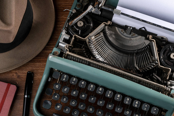 vintage typewriter with old paper and a notebook - Photo, Image