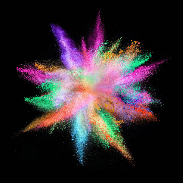 colored powder explosion on black background. - Foto, afbeelding