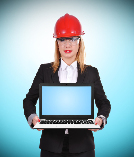 woman engineer holding laptop - Фото, изображение