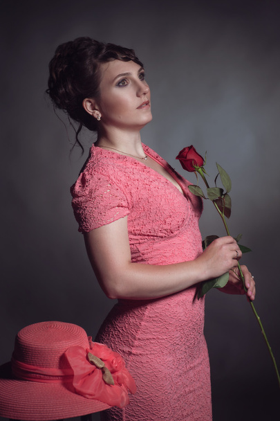 Brunette woman in pink dress - Foto, Bild