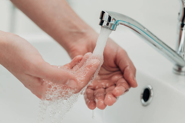 The Girl Washes Her Hands to Avoid Infection With the Virus COVID-19. - Φωτογραφία, εικόνα