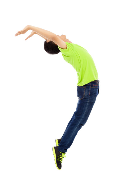 young man jumping and bending his body - Foto, imagen