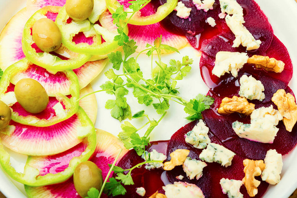 Vegetable salad with beets, bell pepper,cheese and nuts.Healthy vegetable salad - Photo, image