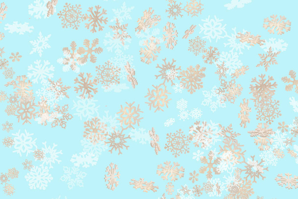 Beautiful snowflake Christmas pattern white and gold falling on a sky blue background - Foto, Imagem