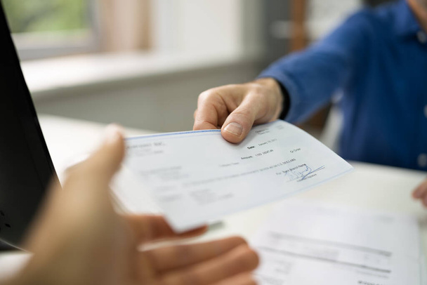Handing Employee Payroll Cheque. Security Check And Salary Checkbook - Fotografie, Obrázek