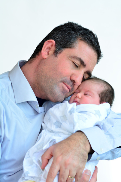 Father and newborn baby kissing and hugging. - Photo, Image