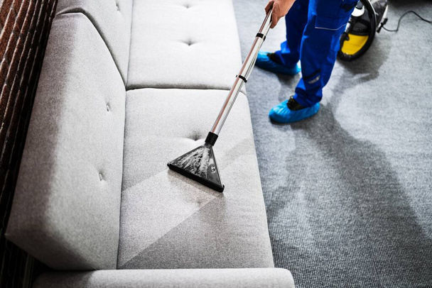 Professional Sofa Cleaning Service Using Vacuum Cleaner - Фото, изображение