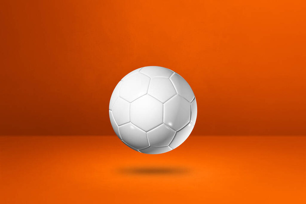 White soccer ball isolated on a orange studio background. 3D illustration - Foto, imagen