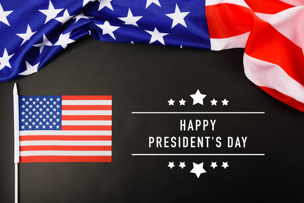 "United States National Holidays. American or USA Flag with ""HAPPY PRESIDENT'S DAY"" text on black background, President Day concept" - Fotó, kép