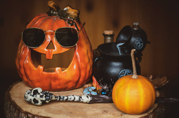 Halloween composition with a funny pumpkin, mystical design for home, interesting ideas for party, details of dcor - Photo, Image