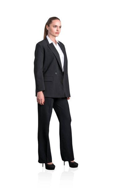 Young attractive businesswoman wearing formal suit is standing. Concept of contemporary successful business people. Isolated over white background - Foto, imagen