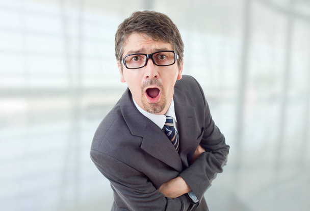 young business man surprised at the office - 写真・画像
