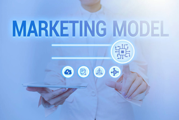 Text sign showing Marketing Model. Conceptual photo statistical analysis likemultivariate regressions on sales Lady Holding Tablet Pressing On Virtual Button Showing Futuristic Tech. - Photo, Image