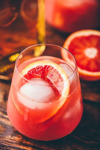 Whiskey sour cocktail with aged bourbon, blood orange juice and simple syrup - Φωτογραφία, εικόνα