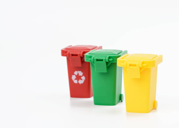red, yellow and green plastic waste sorting container on white background, close up - Photo, image