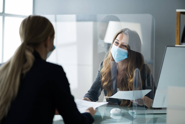 Financial Advisor Or Tax Consultant Wearing Medical Face Mask - Foto, afbeelding