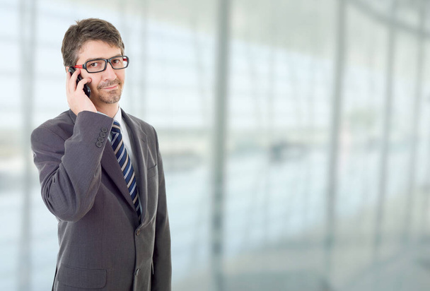 young business man on the phone, at the office - 写真・画像