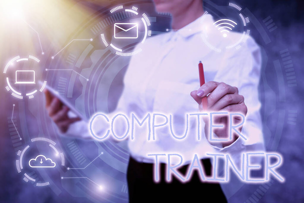 Sign displaying Computer Trainer. Word for instruct and help users acquire proficiency in computer Lady In Uniform Holding Tablet In Hand Virtually Typing Futuristic Tech. - Photo, Image