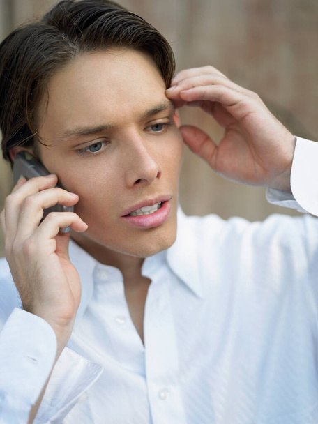 close-up of a young man talking on the phone - Foto, Imagem