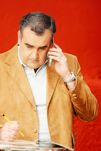 portrait of a businessman talking on phone - Fotoğraf, Görsel
