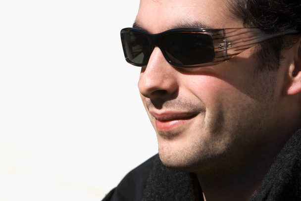 portrait of a handsome young man in sunglasses - Photo, Image