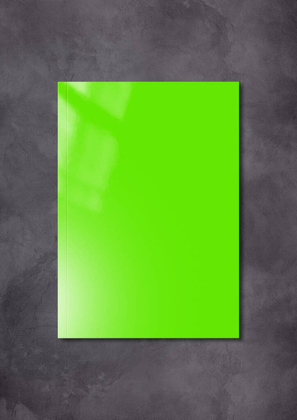Green booklet cover isolated on dark concrete background, mockup template - Foto, imagen
