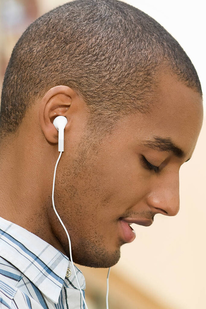 close-up of a young man with headphones - Foto, Imagem