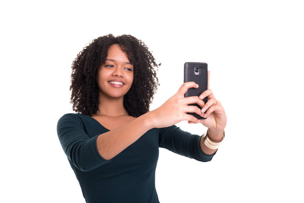 beautiful young african american woman with mobile phone isolated on white background - Fotografie, Obrázek