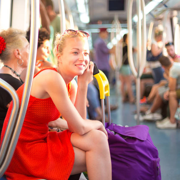 Lady traveling by metro. - 写真・画像