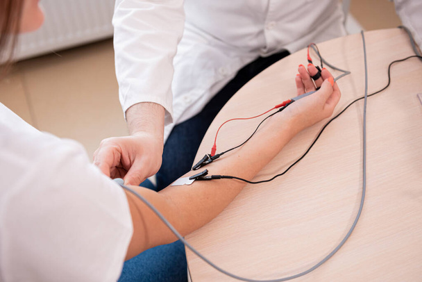 Patient nerves testing using electromyography at medical center - Fotó, kép