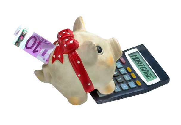 Piggy bank and calculator with the word mortgage written on it, - Photo, Image