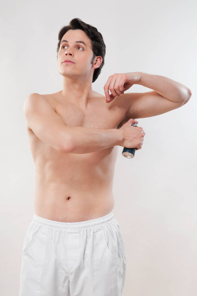 young man with a towel on his back - Photo, image